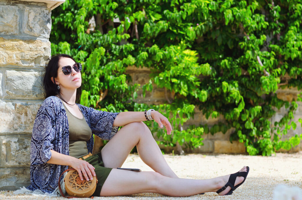 Young woman leaning against a wall outside representing someone coming to terms with their ADHD diagnosis. ADHD is not an insurmountable challenge. With ADHD focused therapy in NYC you can harness the power of ADHD and learn to live your best life. Learn more here.