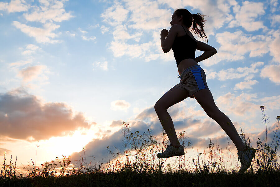 Woman running on a trail representing someone using exercise to help cope with social anxiety disorder and ADHD. Learn the skills to persevere with ADHD-Focused Therapy for Anxiety in NY, NY.