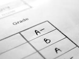 A picture of a piece of paper that reads "Grade" with an A-, B, and A. 